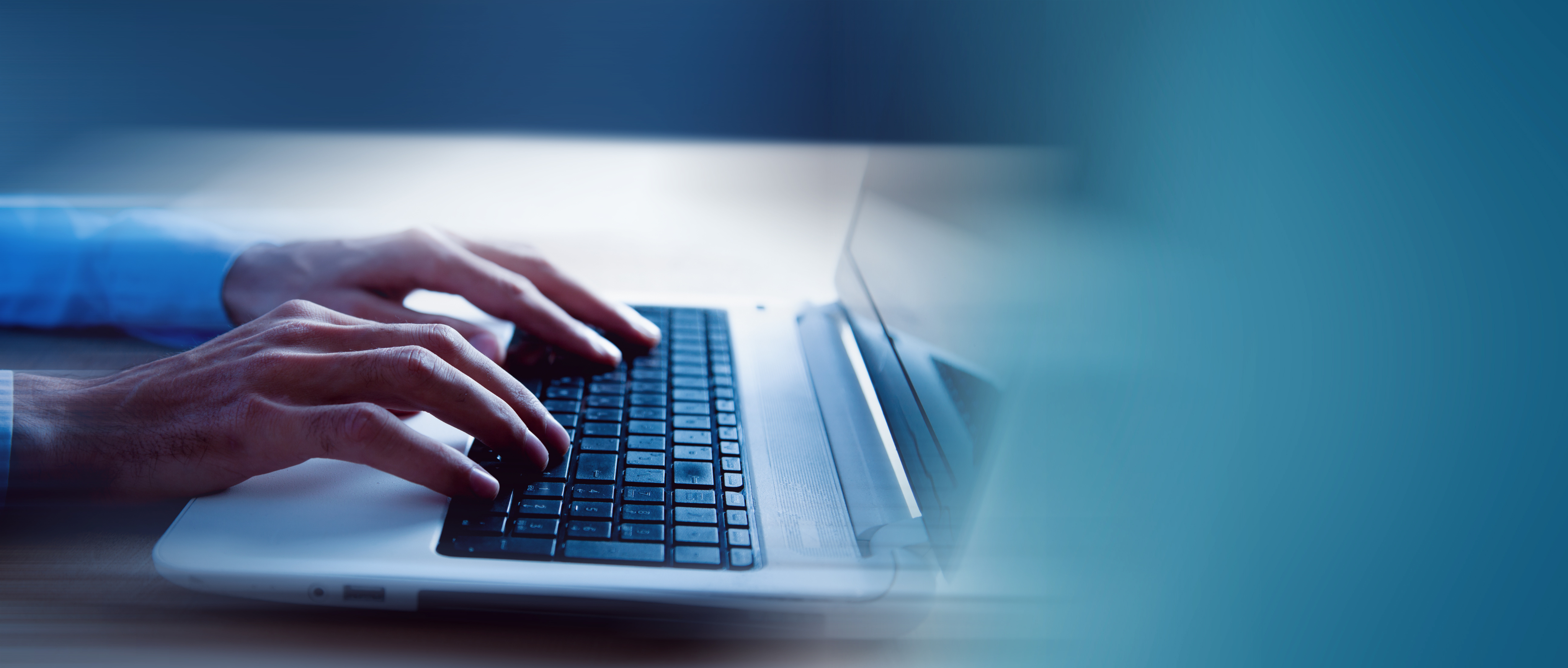 Hands typing on keyboard